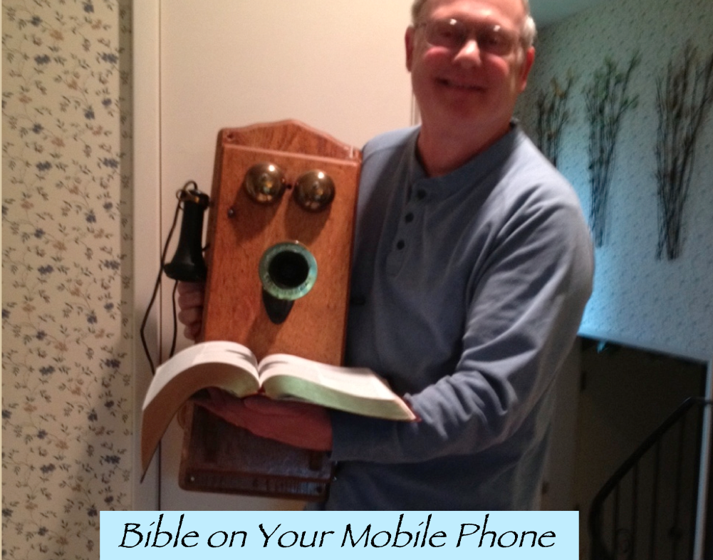 Drew Holding a Compact Bible on Your Mobile Phone
